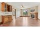 Stylish living area with fireplace, hardwood floors, and built-in storage solutions at 2825 S State Road 267, Plainfield, IN 46168
