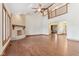 Open living room with fireplace and views of the upper level and entryway at 2825 S State Road 267, Plainfield, IN 46168