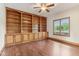 Office with wood floors, built-in bookshelves, and natural light from the window at 2825 S State Road 267, Plainfield, IN 46168
