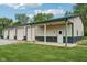 Spacious outbuilding with multiple garage doors and a covered porch, offering versatility at 2825 S State Road 267, Plainfield, IN 46168