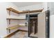 Pantry with shelves, tile floors, and gun safe at 2825 S State Road 267, Plainfield, IN 46168