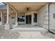 Inviting covered patio featuring a ceiling fan and brick detailing, perfect for relaxation and outdoor entertainment at 2825 S State Road 267, Plainfield, IN 46168