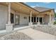 Charming covered patio with stone pillars and gravel landscaping, offering a delightful outdoor space at 2825 S State Road 267, Plainfield, IN 46168