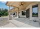 Stylish covered patio with decorative fan and stone accents, creating a comfortable outdoor retreat at 2825 S State Road 267, Plainfield, IN 46168