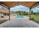 Inviting backyard pool with a covered patio that offers a relaxing outdoor space at 2825 S State Road 267, Plainfield, IN 46168