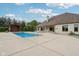 An inviting pool with a pool house and covered patio creating the perfect backyard oasis at 2825 S State Road 267, Plainfield, IN 46168