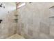 Walk in shower featuring built in shelving and bronze fixtures at 2825 S State Road 267, Plainfield, IN 46168