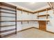 Walk-in closet featuring wooden shelving and carpet flooring at 2825 S State Road 267, Plainfield, IN 46168