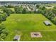 Green backyard with shed, garden plots, and play structure ready for use at 2825 S State Road 267, Plainfield, IN 46168