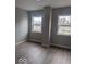 Bedroom with beautiful hardwood floors and windows at 2968 N Arsenal Ave, Indianapolis, IN 46218