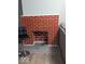 Cozy fireplace with red brick and white accents, complemented by modern furniture at 2968 N Arsenal Ave, Indianapolis, IN 46218