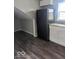 View of kitchen with a dark color palette and lots of storage at 2968 N Arsenal Ave, Indianapolis, IN 46218