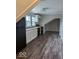 Bright kitchen features new cabinets, modern appliances, and wood flooring at 2968 N Arsenal Ave, Indianapolis, IN 46218
