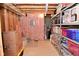 Unfinished basement section with pink insulation, electrical panel, and organized storage shelving at 3251 Amber Way, Bargersville, IN 46106