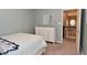 Tranquil bedroom with a white dresser, and doorway view of the home's stairway at 3251 Amber Way, Bargersville, IN 46106