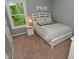 Serene bedroom with a white bed, soft blue walls, and a large window with green view at 3251 Amber Way, Bargersville, IN 46106