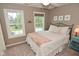 Cozy bedroom with carpet, large windows, and a comfortable bed, creating a peaceful retreat at 3251 Amber Way, Bargersville, IN 46106