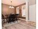 A dining room featuring a wooden table, chairs, chandelier, and decor accents at 3251 Amber Way, Bargersville, IN 46106
