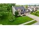 Beautiful two-story home with a well-manicured lawn, lush landscaping and charming brick and vinyl facade at 3251 Amber Way, Bargersville, IN 46106