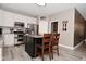 Beautiful kitchen with stainless steel appliances, granite countertops, and a stylish kitchen island with seating at 3251 Amber Way, Bargersville, IN 46106
