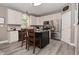 This kitchen offers white cabinetry, a center island with breakfast bar, and stainless steel appliances at 3251 Amber Way, Bargersville, IN 46106