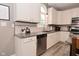 Modern kitchen featuring granite counters, a stainless steel dishwasher, and white cabinets at 3251 Amber Way, Bargersville, IN 46106