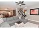Spacious living room with open access to the kitchen and dining area, featuring a comfortable sectional sofa at 3251 Amber Way, Bargersville, IN 46106