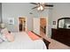 Large bedroom with a walk-in closet, stairway view, and a dark wood dresser at 3251 Amber Way, Bargersville, IN 46106