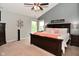 Main bedroom with vaulted ceiling, dark wood bed frame, and decorative wall art at 3251 Amber Way, Bargersville, IN 46106