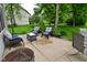 Patio featuring cushioned seating, a fire pit, and a view of the green backyard at 3251 Amber Way, Bargersville, IN 46106
