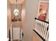Upstairs hallway featuring neutral colors, a decorative light fixture, and a view into a bedroom at 3251 Amber Way, Bargersville, IN 46106