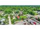 A lush, green residential area with many trees and houses nestled within, providing a peaceful, suburban atmosphere at 3310 Ransdell St, Indianapolis, IN 46227