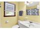 Bright bathroom featuring a vanity with sink, a mirror, and a toilet at 3310 Ransdell St, Indianapolis, IN 46227