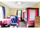 Bedroom featuring two beds, natural light, and hardwood floors at 3310 Ransdell St, Indianapolis, IN 46227