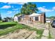 Charming single story home with an inviting wooden access ramp and a well-manicured lawn at 3310 Ransdell St, Indianapolis, IN 46227