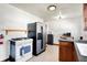 Functional kitchen with stainless steel refrigerator, gas range, and ample countertop space at 3310 Ransdell St, Indianapolis, IN 46227