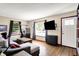 Inviting living room showcasing hardwood floors, abundant natural light, and stylish, comfortable furnishings at 3310 Ransdell St, Indianapolis, IN 46227