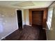Bedroom featuring hardwood floors, a window for natural light, and a closet at 3403 Coffey St, Indianapolis, IN 46217