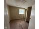 Bedroom with neutral carpet, closet, and window offering natural light at 3403 Coffey St, Indianapolis, IN 46217
