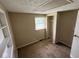 Bedroom with neutral carpet, closet, and window offering natural light at 3403 Coffey St, Indianapolis, IN 46217