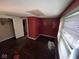 Bedroom features red accent wall and a window letting in natural light at 3403 Coffey St, Indianapolis, IN 46217