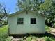Rear exterior view of a home with white siding and two windows at 3403 Coffey St, Indianapolis, IN 46217