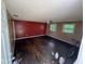 View of living room showcasing hardwood floors, ceiling fan, and interior doorway at 3403 Coffey St, Indianapolis, IN 46217