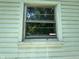 Exterior window view showcasing trim and natural light, enhancing home's curb appeal at 3403 Coffey St, Indianapolis, IN 46217