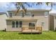 Home exterior featuring a wooden deck with view of lawn and the back of home at 3419 Burlingame Blvd, Carmel, IN 46074