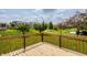 View from wooden deck of lush backyard, mature trees, and community walking path at 3419 Burlingame Blvd, Carmel, IN 46074