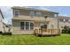 Home exterior featuring a wooden deck and lawn at 3419 Burlingame Blvd, Carmel, IN 46074