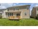 Two-story home exterior featuring a wooden deck and a well-manicured lawn at 3419 Burlingame Blvd, Carmel, IN 46074