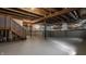 Spacious unfinished basement with concrete floor and exposed ceiling beams ready for customization at 3419 Burlingame Blvd, Carmel, IN 46074
