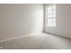 Bedroom featuring neutral carpet, light walls, and a sunlit window at 3419 Burlingame Blvd, Carmel, IN 46074